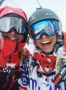 Girlfriends have fun skiing in the ski lift