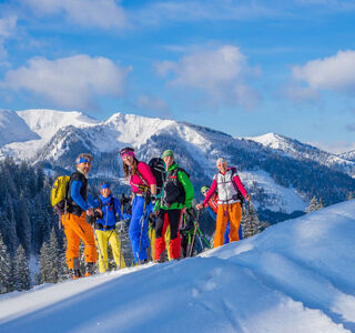 A group of ski tourers on the mountain.