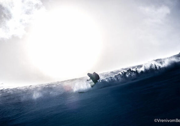 One person skiing in deep snow