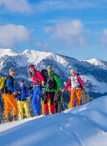 A group of ski tourers on the mountain.