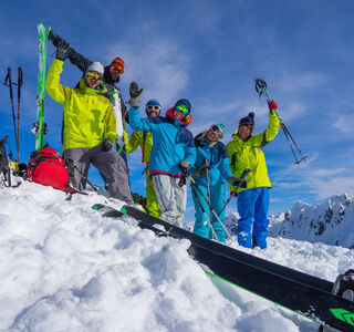 A happy group of friends on the ski slope.