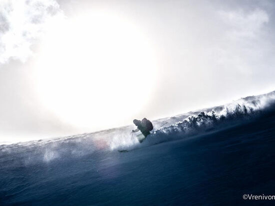 One person skiing in deep snow